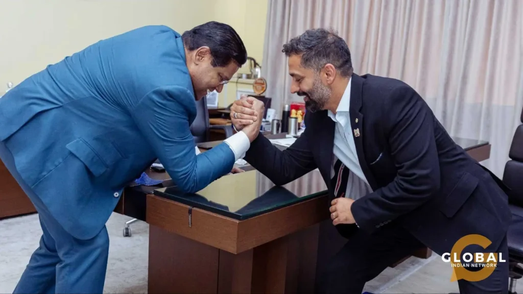 Rajan Nazran arm wrestling with Chan Santokhi